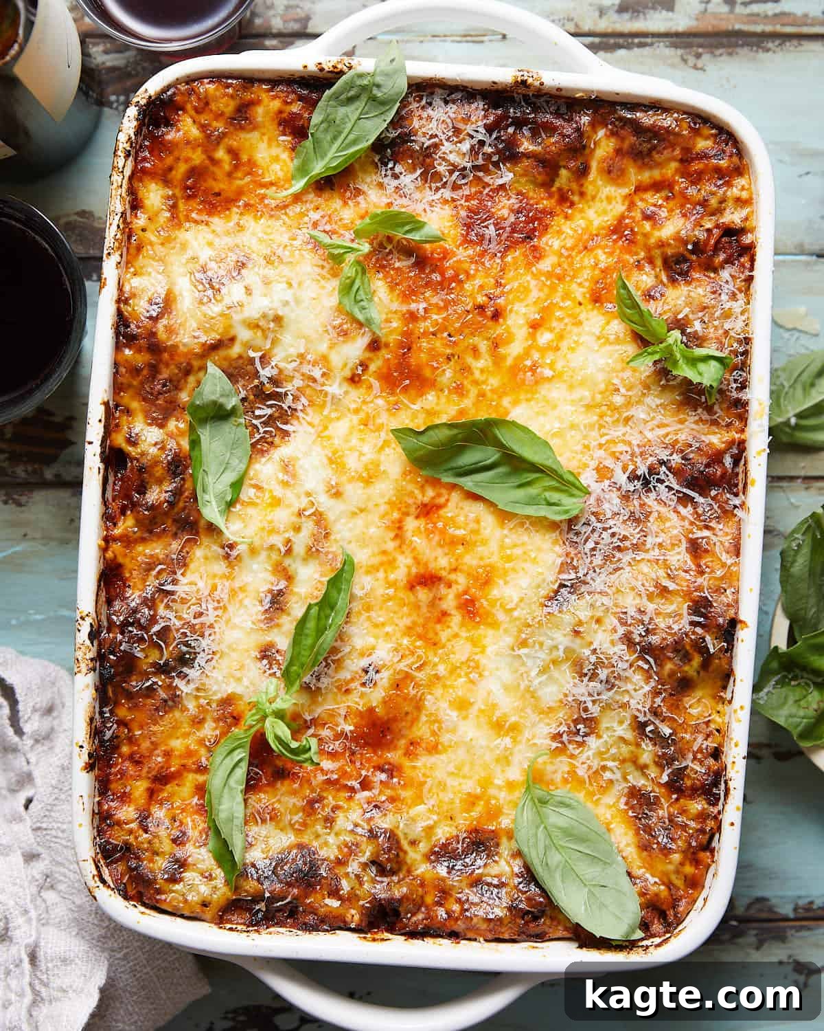 Creamy Béchamel Lasagna 2 Overhead image of lasagna with bechamel sauce in white dish.