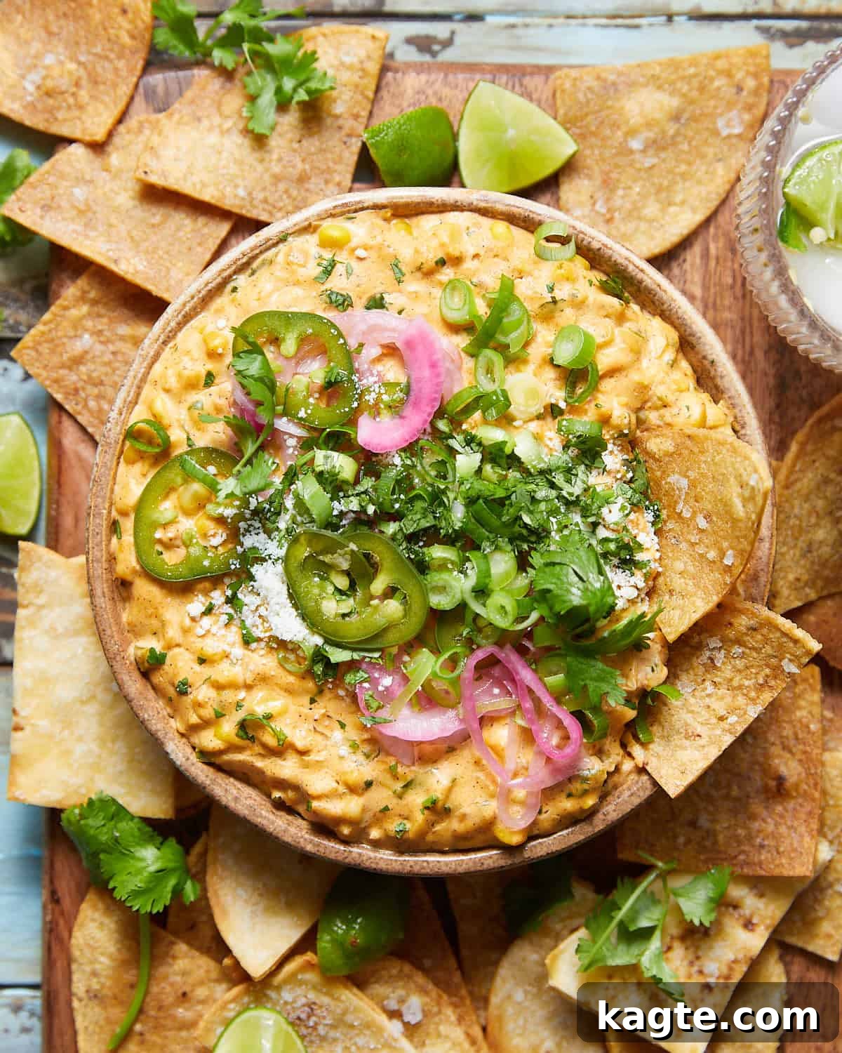 Hot Mexican Street Corn Dip 2 A beautifully garnished hot elote dip, viewed from overhead, with a vibrant blend of colors and textures.
