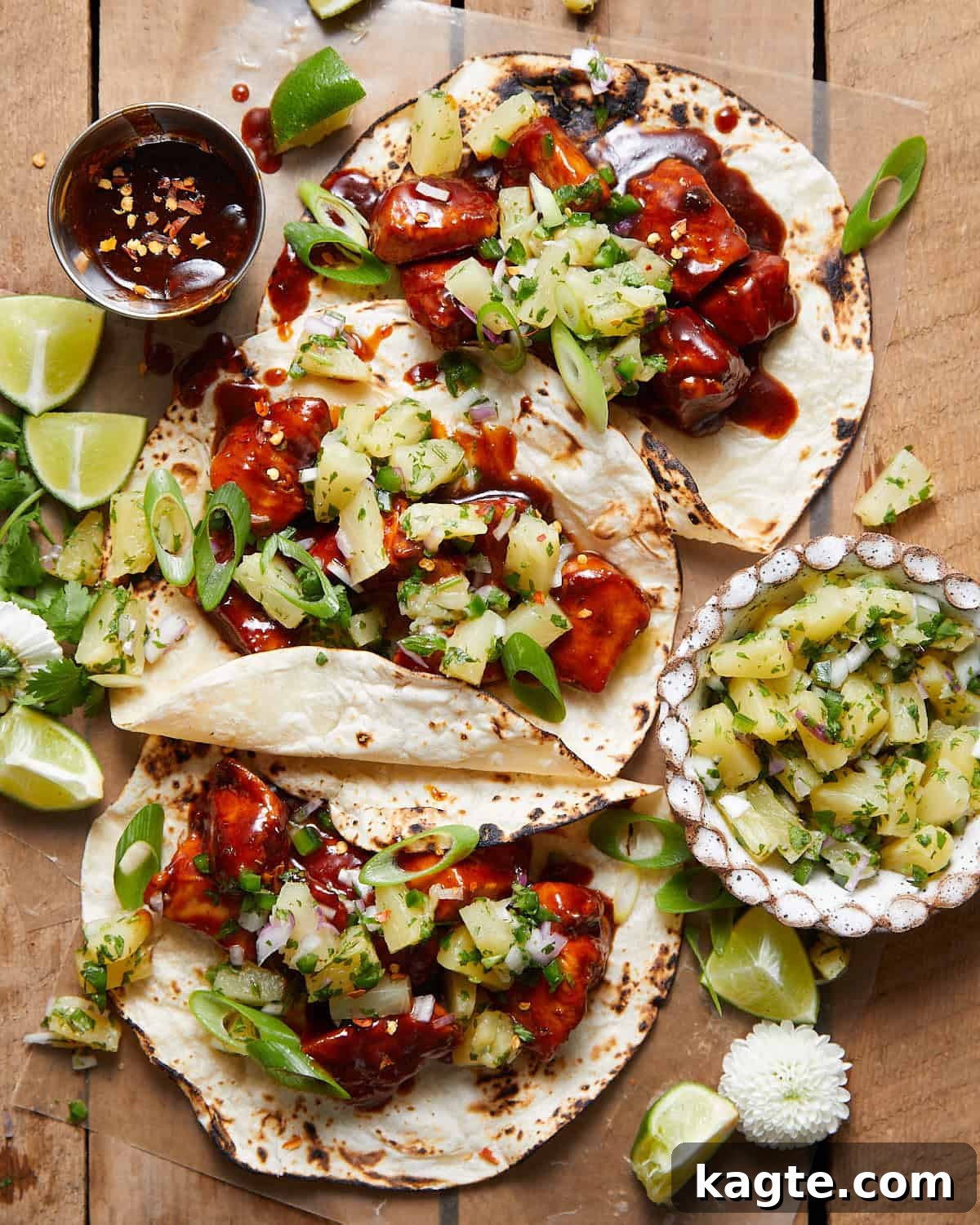 Aloha Chicken Tacos with Fresh Pineapple Salsa 2 Overhead image of Hawaiian chicken tacos with garnish.