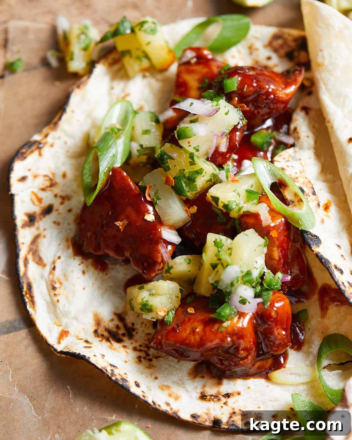 Aloha Chicken Tacos with Fresh Pineapple Salsa 6 Close up image of Hawaiian chicken taco with pineapple salsa.