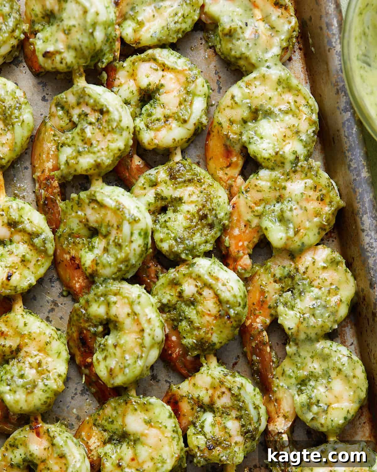 Juicy Oven Baked Shrimp Skewers 2 Overhead image of oven baked shrimp skewers, perfectly golden and garnished with fresh cilantro.