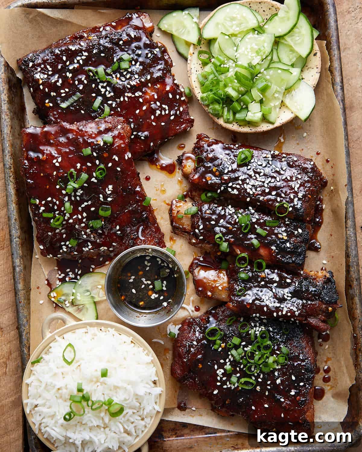 Finger-Licking Asian Oven Ribs 6 Overhead image of sticky asian ribs with garnish.