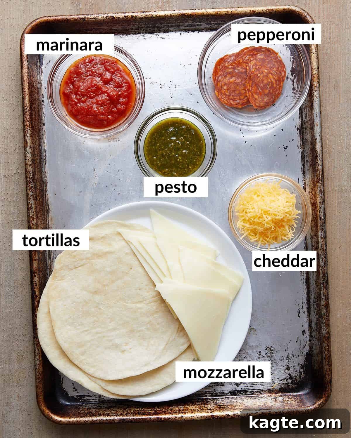 Ultimate Quick Pizza Tortilla Wrap 3 Overhead image of ingredients needed for pizza tortilla wrap, neatly arranged.