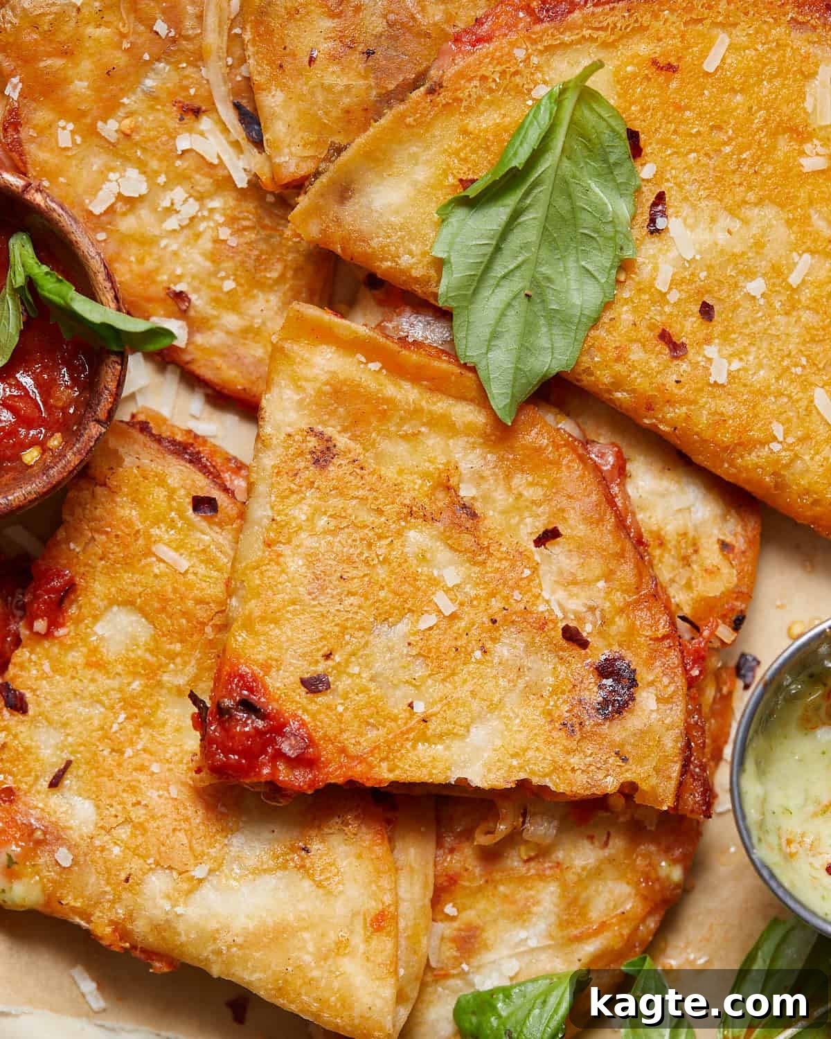 Ultimate Quick Pizza Tortilla Wrap 5 Up close image of golden, crispy pizza tortilla wraps, cut in half to show the melted cheese and toppings.