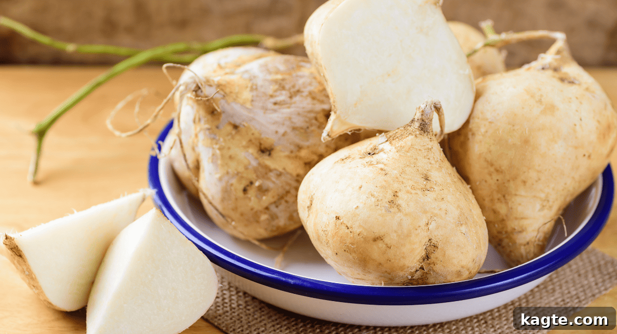 12 Savvy Celery Swaps 11 A whole jicama root with its rough, light-brown skin partially peeled, revealing the crisp, white, edible flesh within.