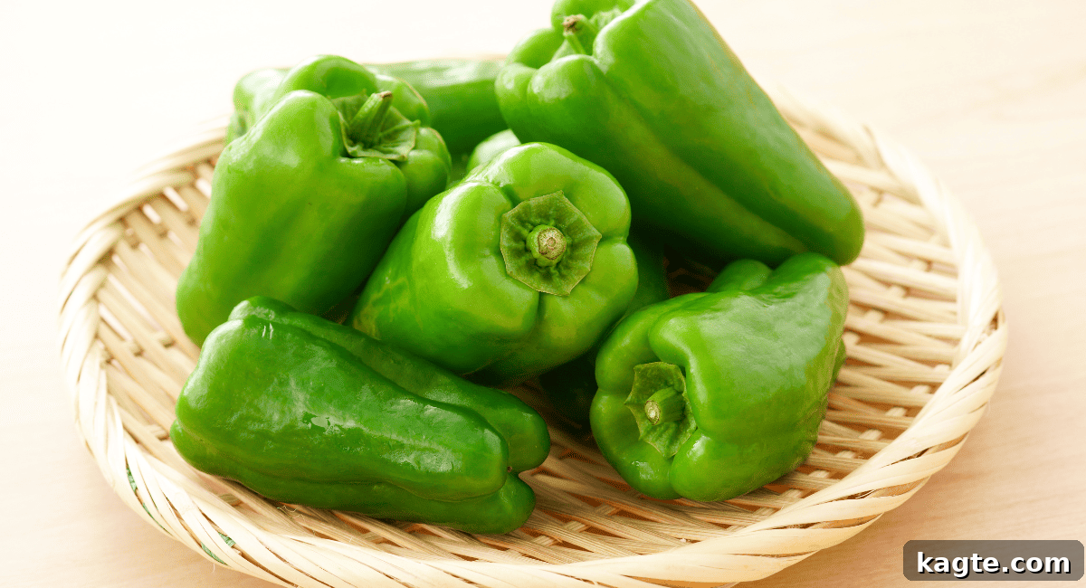 12 Savvy Celery Swaps 10 A single, whole green bell pepper, fresh and vibrant, indicating its crisp texture and mild, slightly bitter flavor.