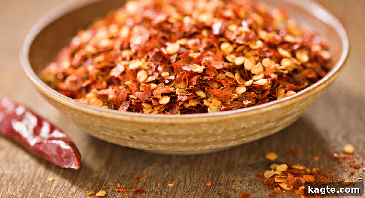 No Chili Oil? 8 Savvy Substitutes to Save Your Meal 8 Up close image of red pepper flakes in brown bowl.