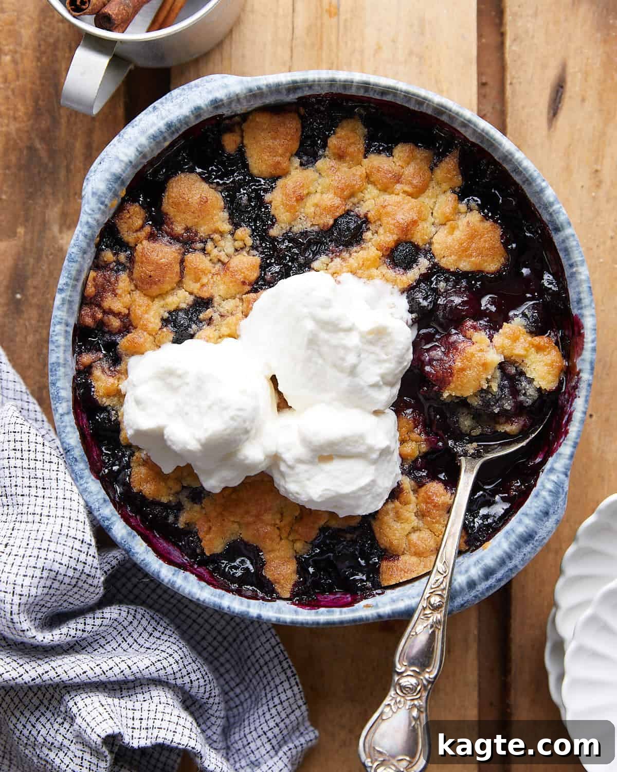 Effortless Air Fryer Blueberry Cobbler 2 Overhead image of air fryer blueberry cobbler, showcasing its golden topping and juicy fruit filling.