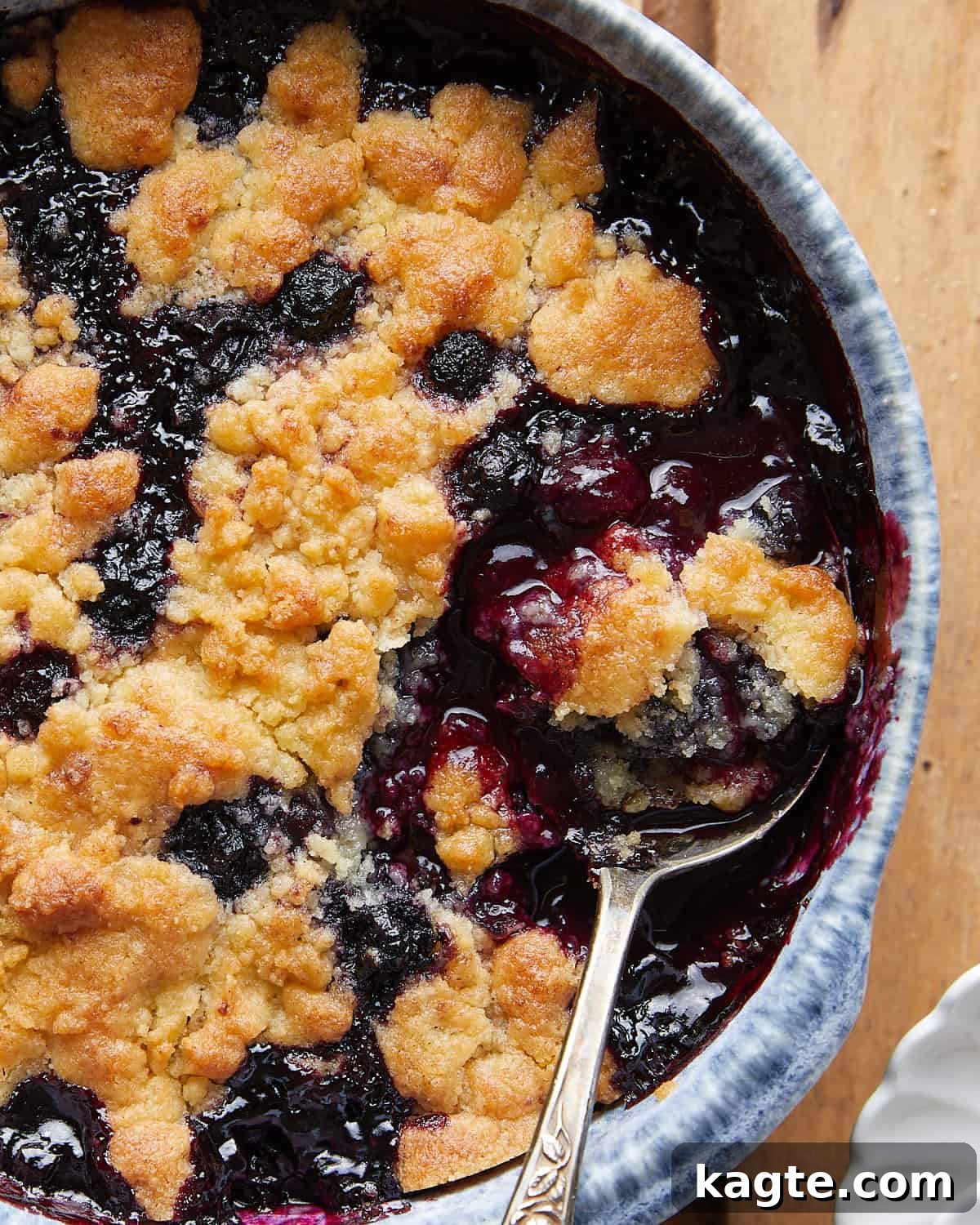 Effortless Air Fryer Blueberry Cobbler 5 Up close image of air fryer blueberry cobbler, showing the texture of the topping and the cooked blueberries.