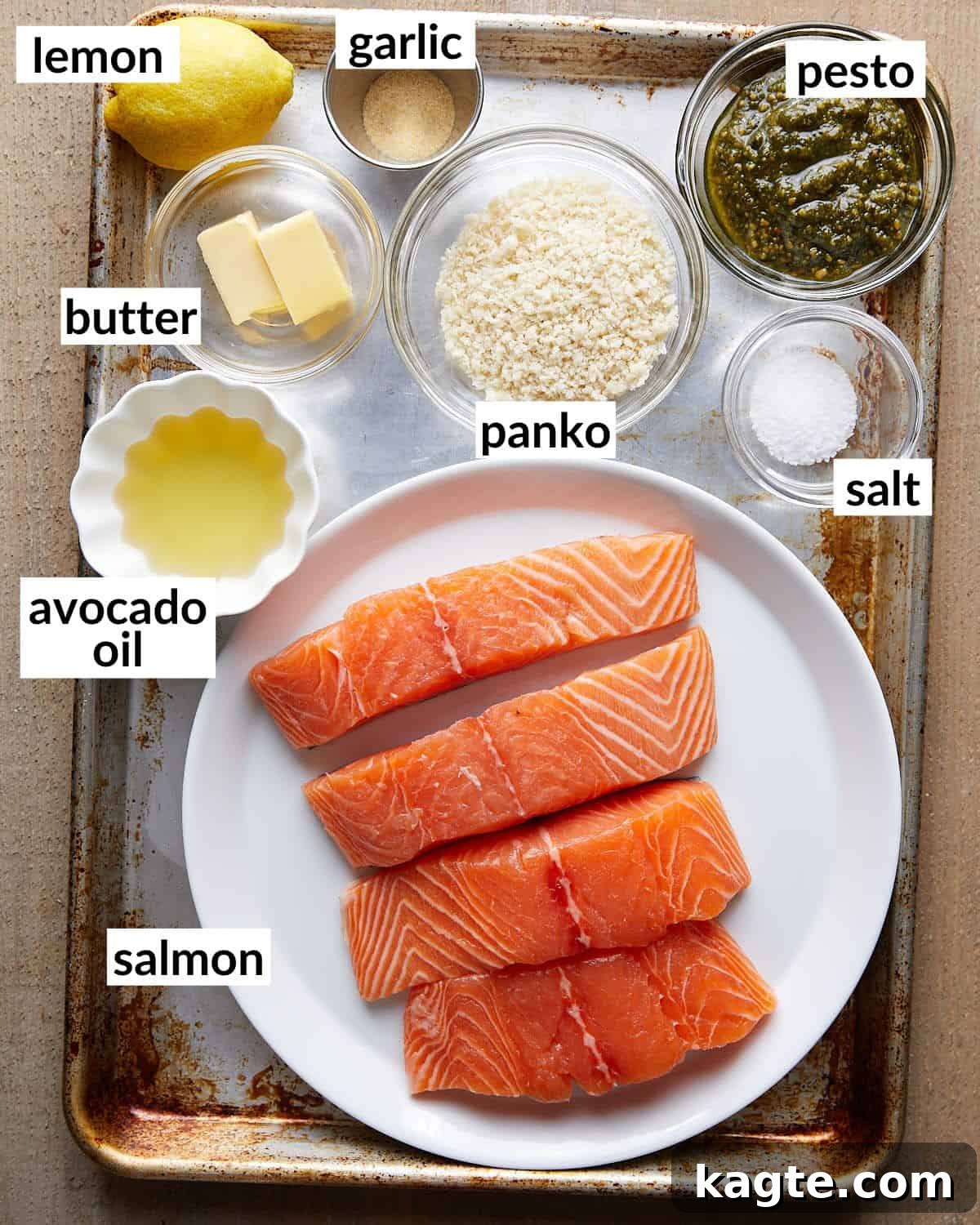 Crispy Pesto Salmon with Lemon Garlic Panko 3 Overhead image of ingredients needed to make pesto crusted salmon with garlic lemon panko, neatly arranged on a white surface.