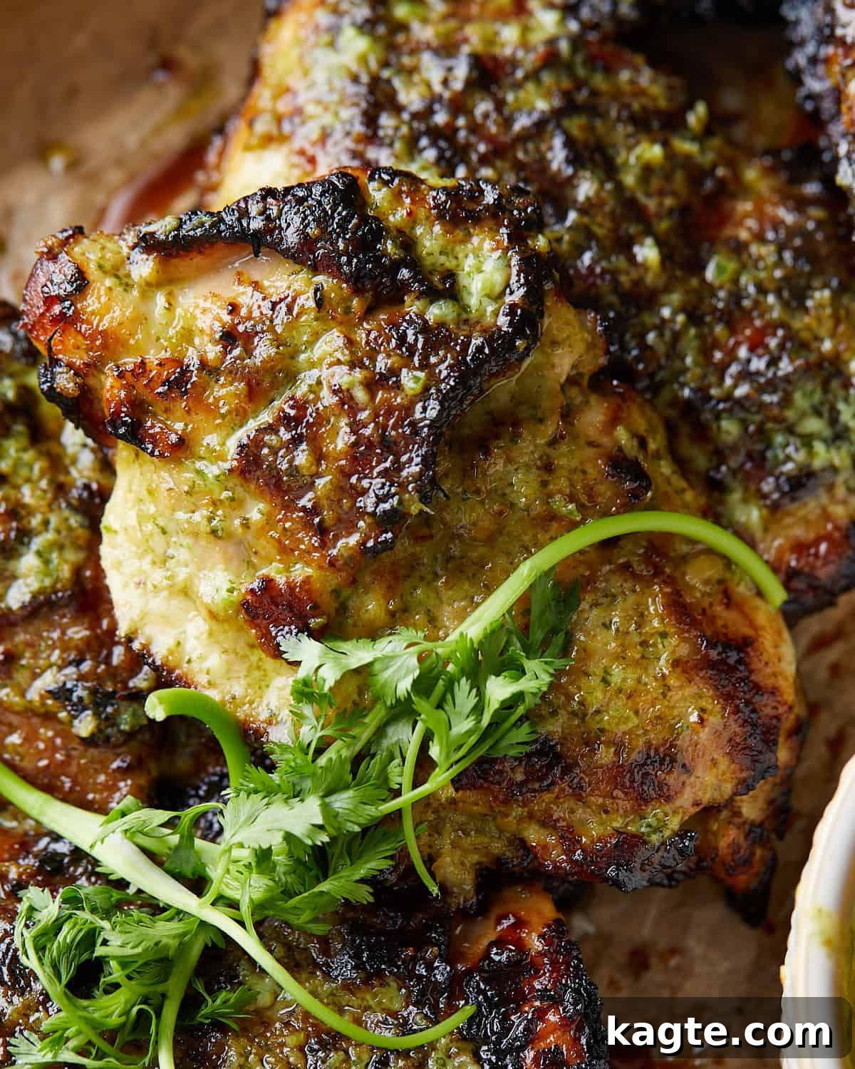 Crispy Air Fryer Cilantro Lime Chicken 5 Up close image of cooked air fryer cilantro lime chicken, showing crispy skin and juicy interior.