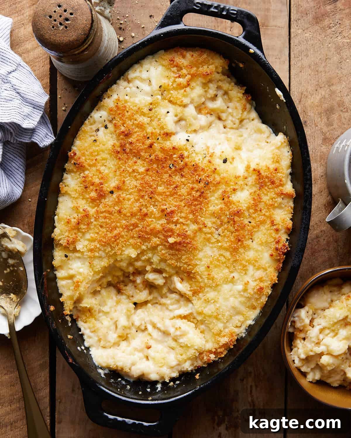 Decadent White Cheddar Macaroni Bake 2 Overhead image of a generous serving of baked white cheddar mac and cheese, showcasing its golden-brown, crispy topping and gooey interior.