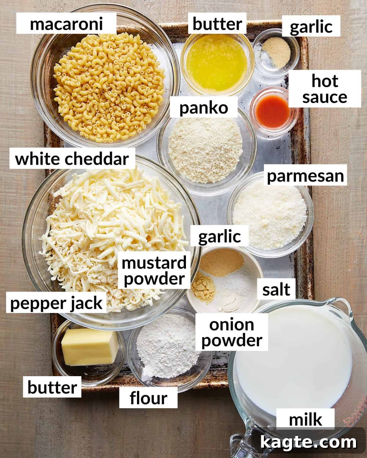 Decadent White Cheddar Macaroni Bake 3 Overhead image of fresh ingredients neatly arranged, ready to be used for making baked white cheddar mac and cheese.