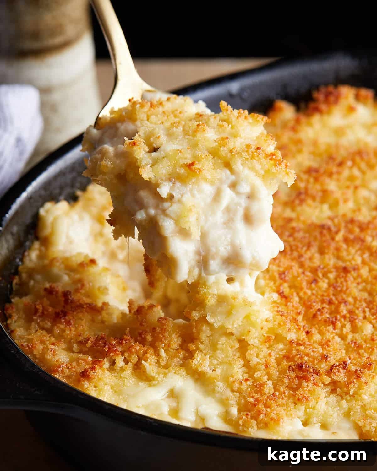 Decadent White Cheddar Macaroni Bake 7 Up close image of baked white cheddar mac and cheese, highlighting its rich, bubbly texture and perfect golden crust.