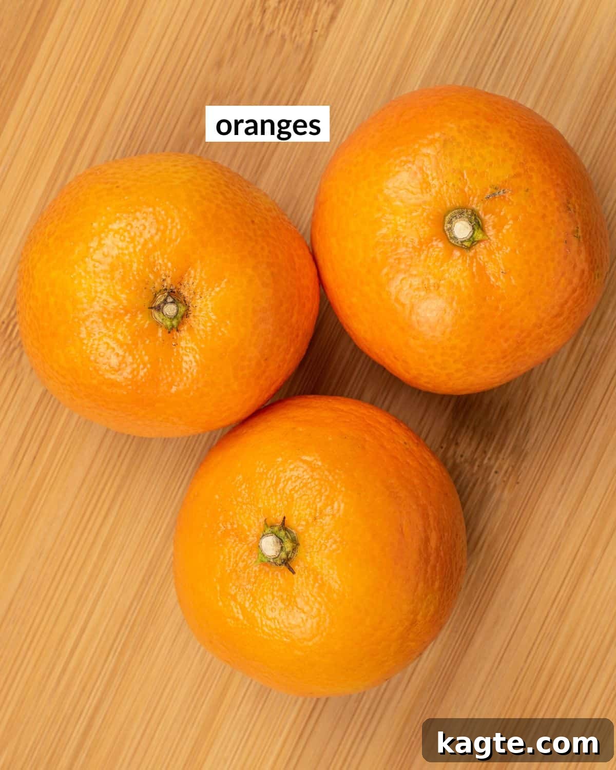 Overhead image of ingredients needed to make dry oranges, typically just oranges.