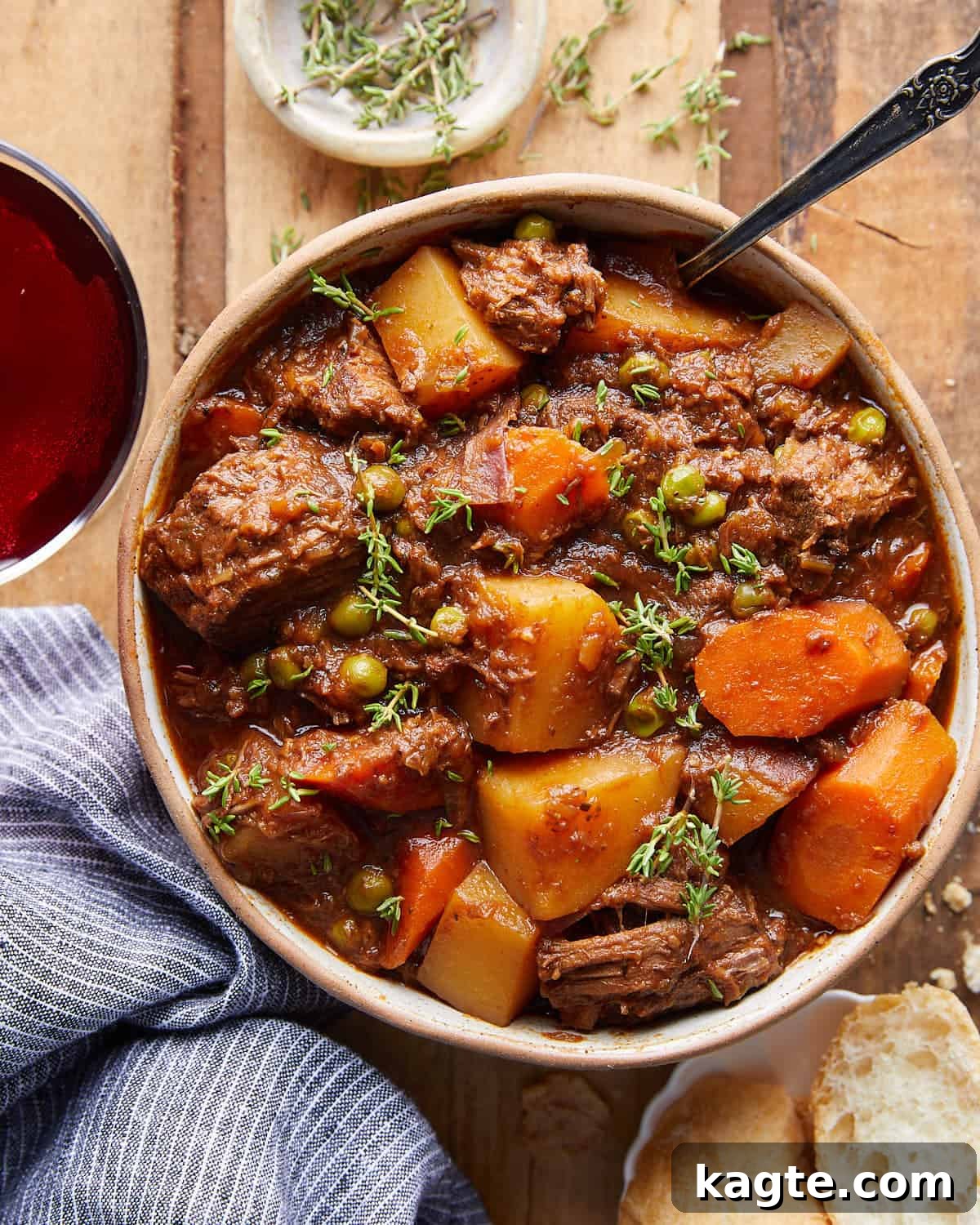 Slow Simmered Stovetop Beef Stew 2 Overhead image of old fashioned beef stew with garnish.