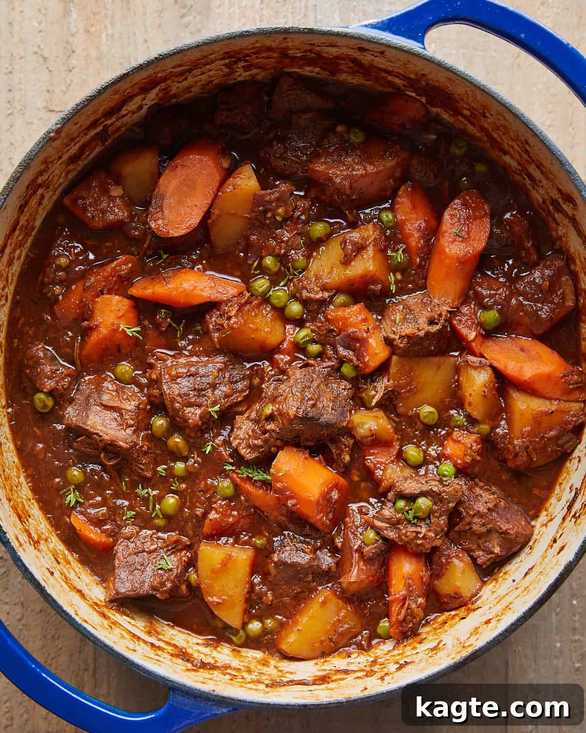 Slow Simmered Stovetop Beef Stew 6 Overhead image of old fashioned beef stew in blue pot.