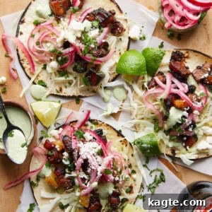 Ultimate Crispy Pork Belly Tacos 6 A finished crispy pork belly taco with fresh toppings.