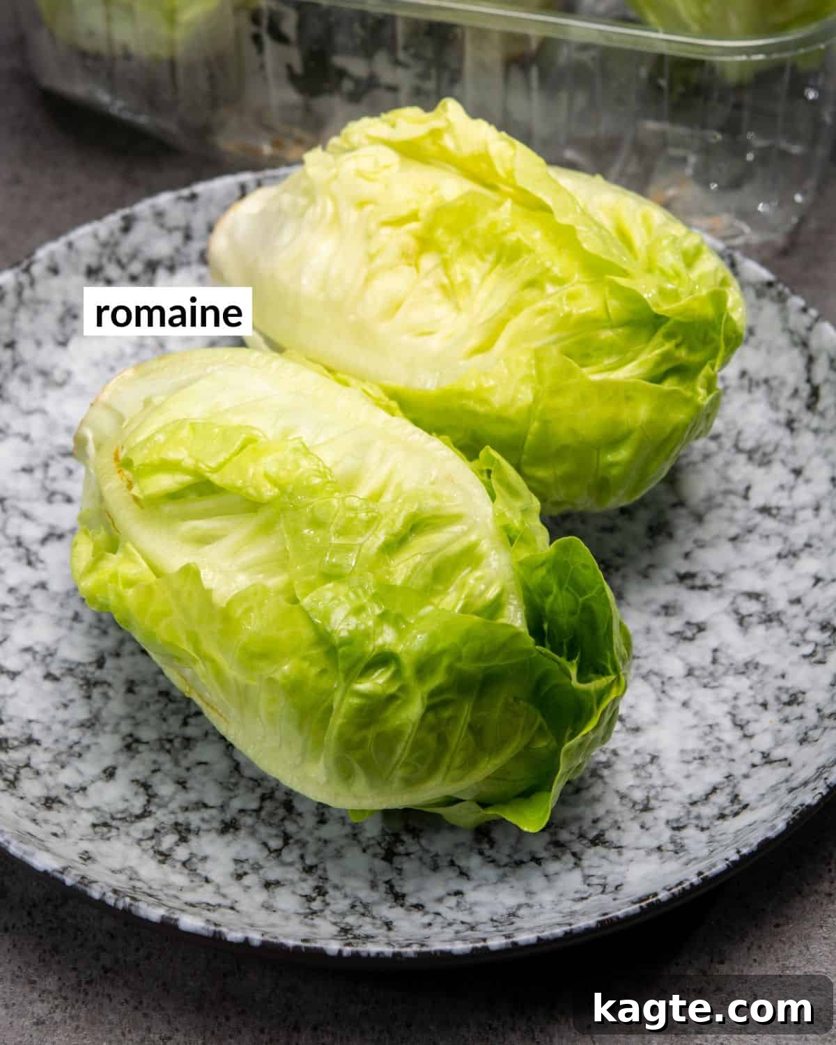 Overhead view of kitchen tools needed for cutting romaine lettuce, including a knife, cutting board, and salad spinner.