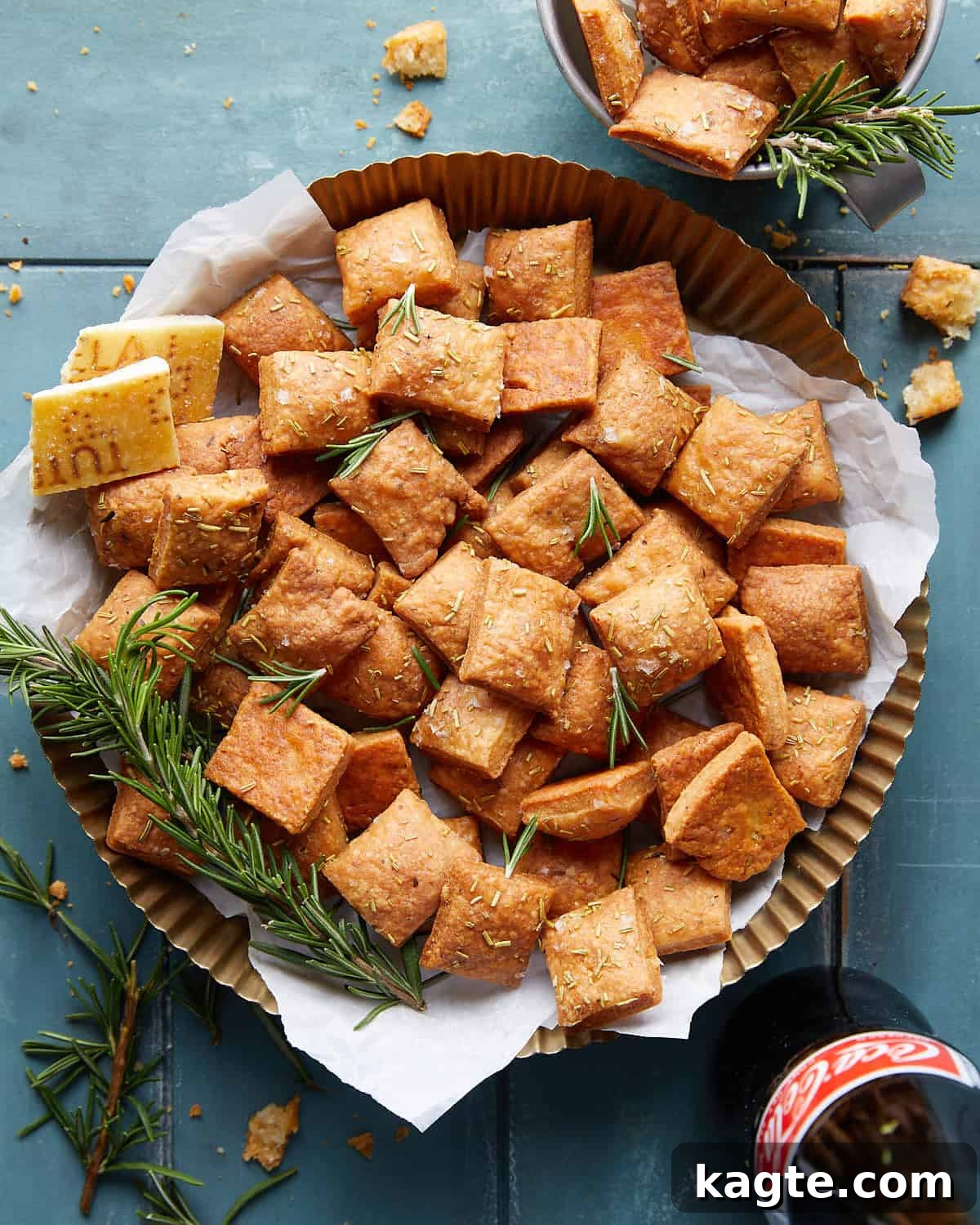 Crispy Parmesan Rosemary Crackers 2 Overhead image of golden brown parmesan rosemary crackers arranged on a rustic board, ready for serving.