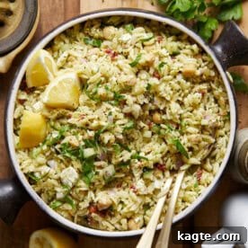 Close-up of Pesto Orzo Salad, highlighting the orzo, chickpeas, sun-dried tomatoes, and feta.