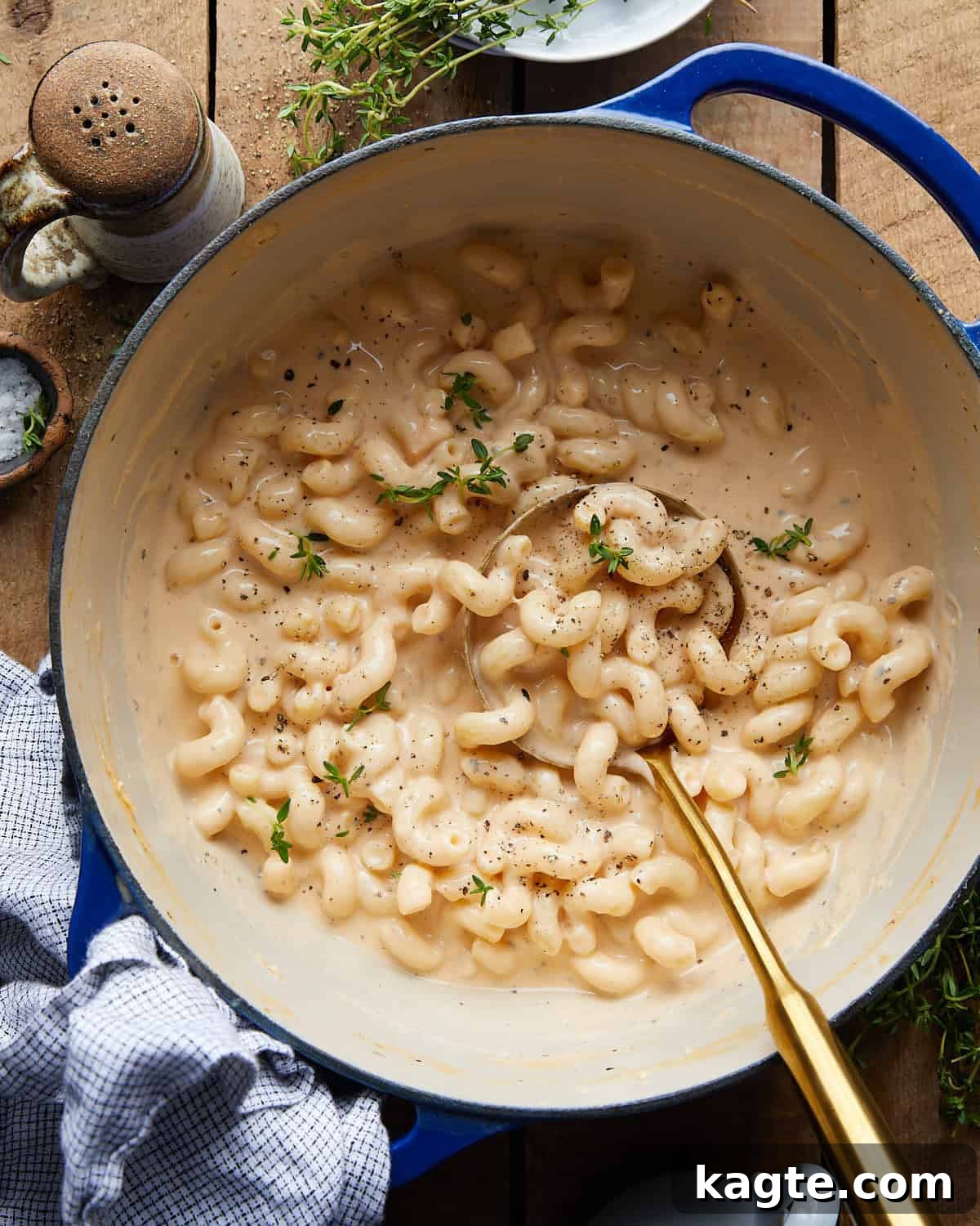 Overhead image of Dutch oven mac and cheese with garnish, showcasing its creamy texture.