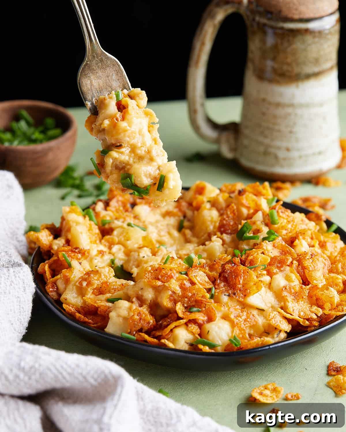 From Scratch Slow Cooker Cheesy Hash Brown Casserole 2 A warm, bubbling crockpot funeral potato casserole with a golden, crispy cornflake topping, garnished with fresh parsley.