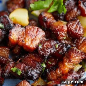 A serving of succulent air fryer pork belly bites, ready to enjoy.