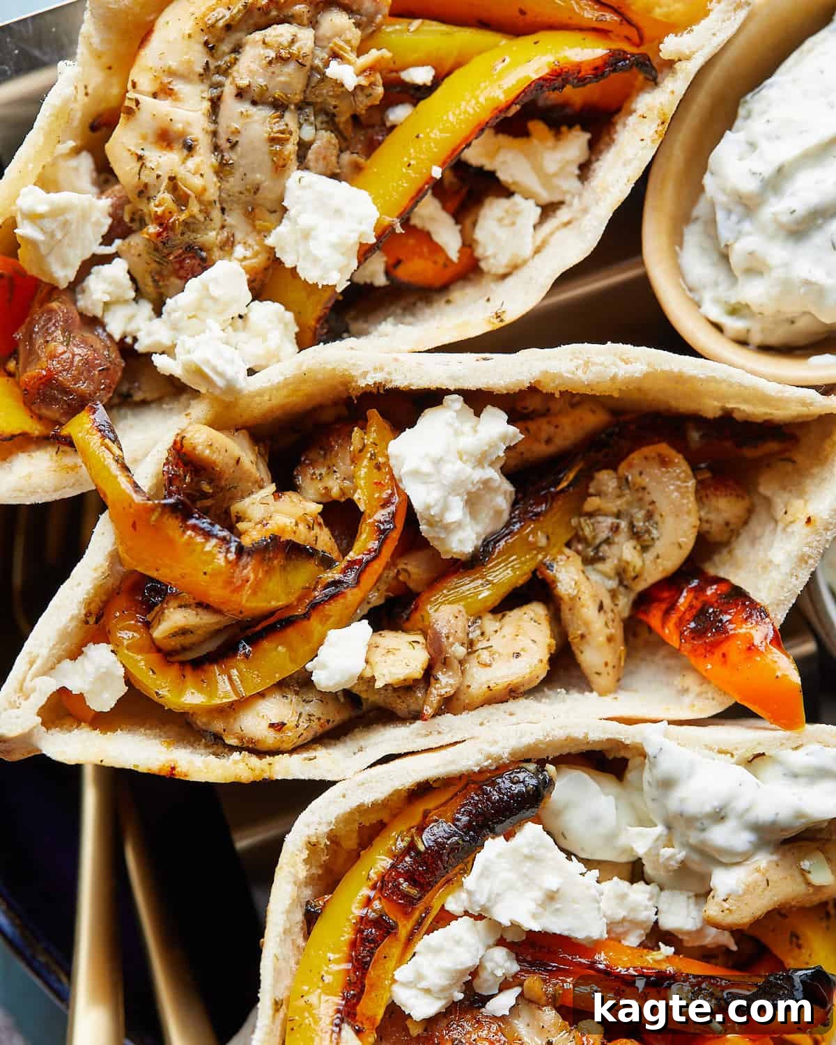Quick Chicken Pita Sandwiches 2 Up close image of chicken pita pockets with garnish, showing the flavorful filling and fresh ingredients.