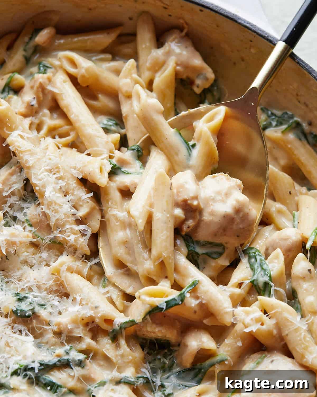 Up close image of garlic chicken pasta with garnish. 