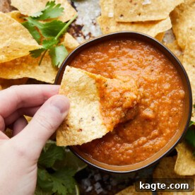 A vibrant bowl of chunky mango habanero salsa with fresh cilantro.