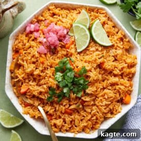 A close-up of fluffy Mexican red rice garnished with fresh cilantro.