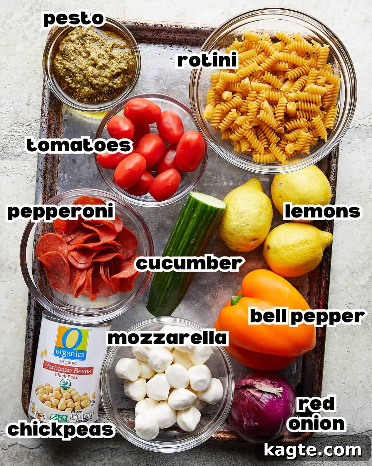 Zesty Italian Pasta Salad 3 Overhead image displaying all fresh ingredients needed to prepare a healthy Italian pasta salad, neatly arranged.