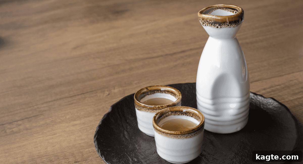 8 Smart Substitutes for Shaoxing Wine 5 Overhead view of a traditional Japanese sake bottle and two small sake cups, suggesting a clean and refined beverage.