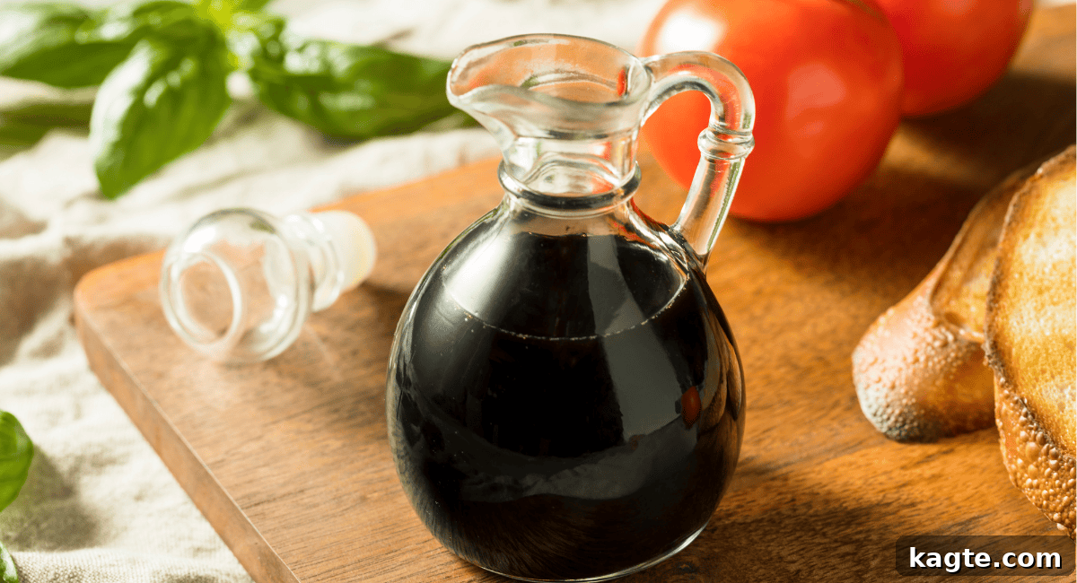 8 Smart Substitutes for Shaoxing Wine 9 Close-up of a stream of dark balsamic vinegar pouring, highlighting its rich color and viscosity.
