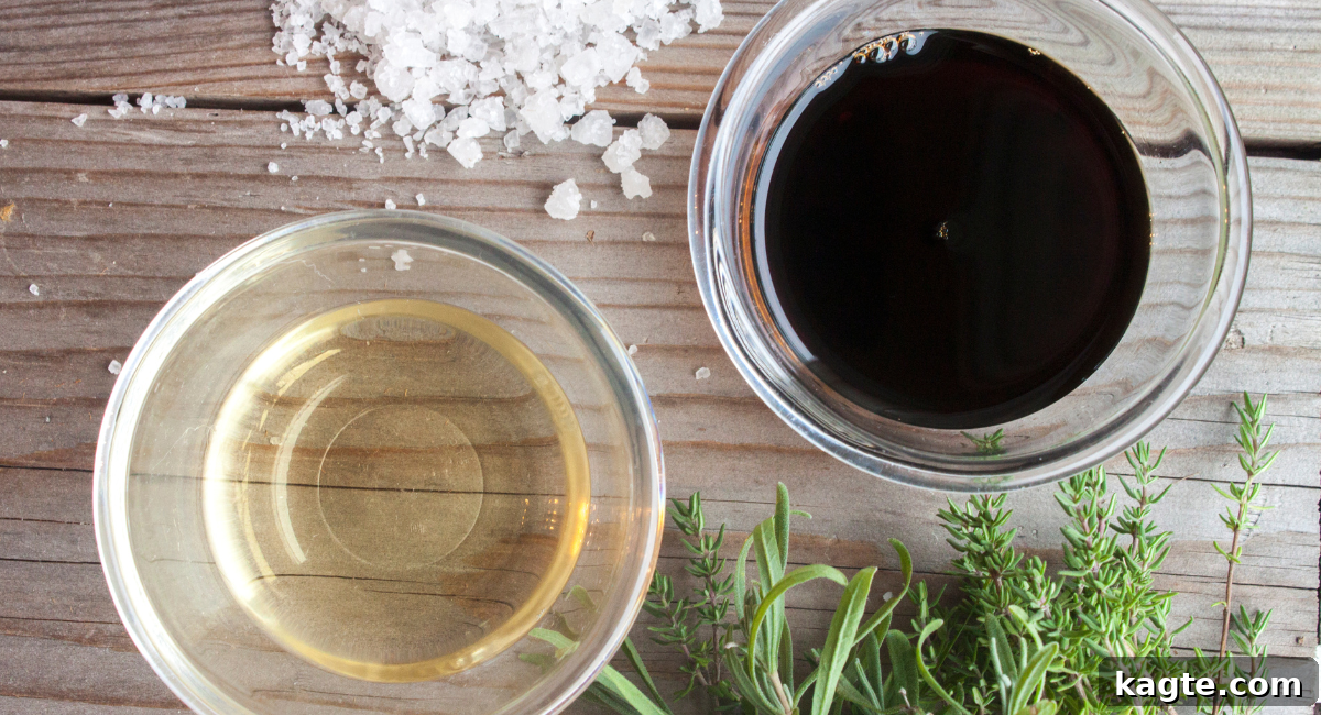 Top 12 Orange Juice Substitutes for Cooking and Baking 9 Overhead image displaying three distinct types of vinegar: clear white vinegar, amber apple cider vinegar with 'the mother,' and dark, glossy balsamic vinegar in bottles and small bowls, illustrating their variety.