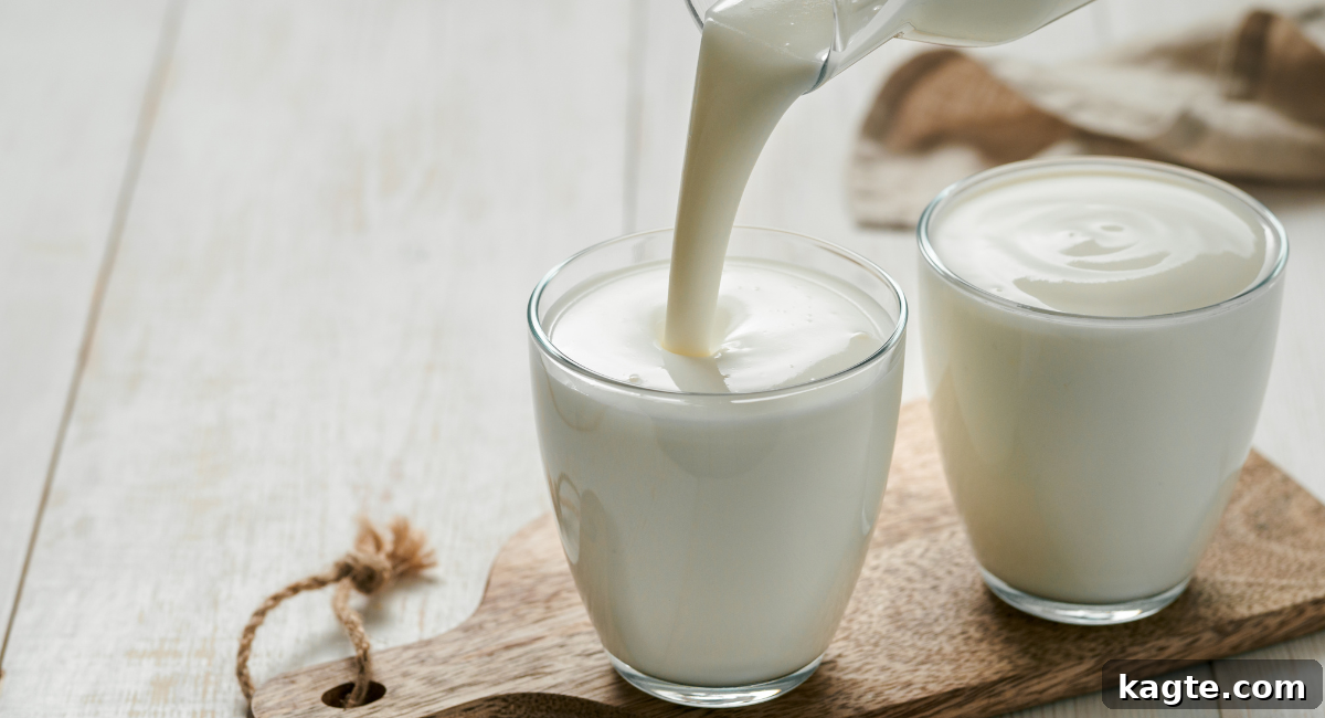 Top 12 Orange Juice Substitutes for Cooking and Baking 10 Close-up image of a glass of fresh buttermilk with a creamy, slightly thick texture, against a rustic kitchen background, suggesting wholesome ingredients.