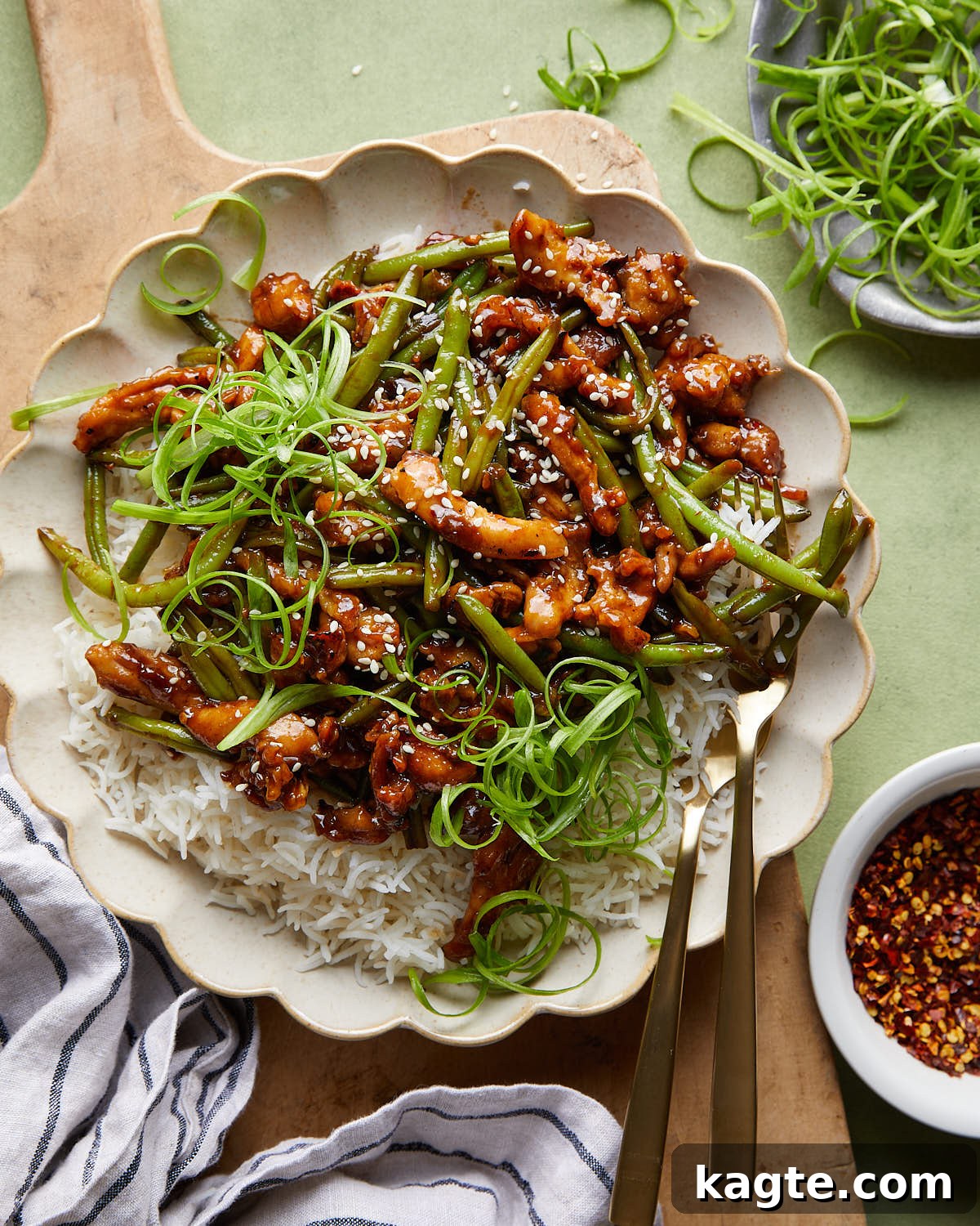 Overhead image of green bean chicken stir fry with garnish.