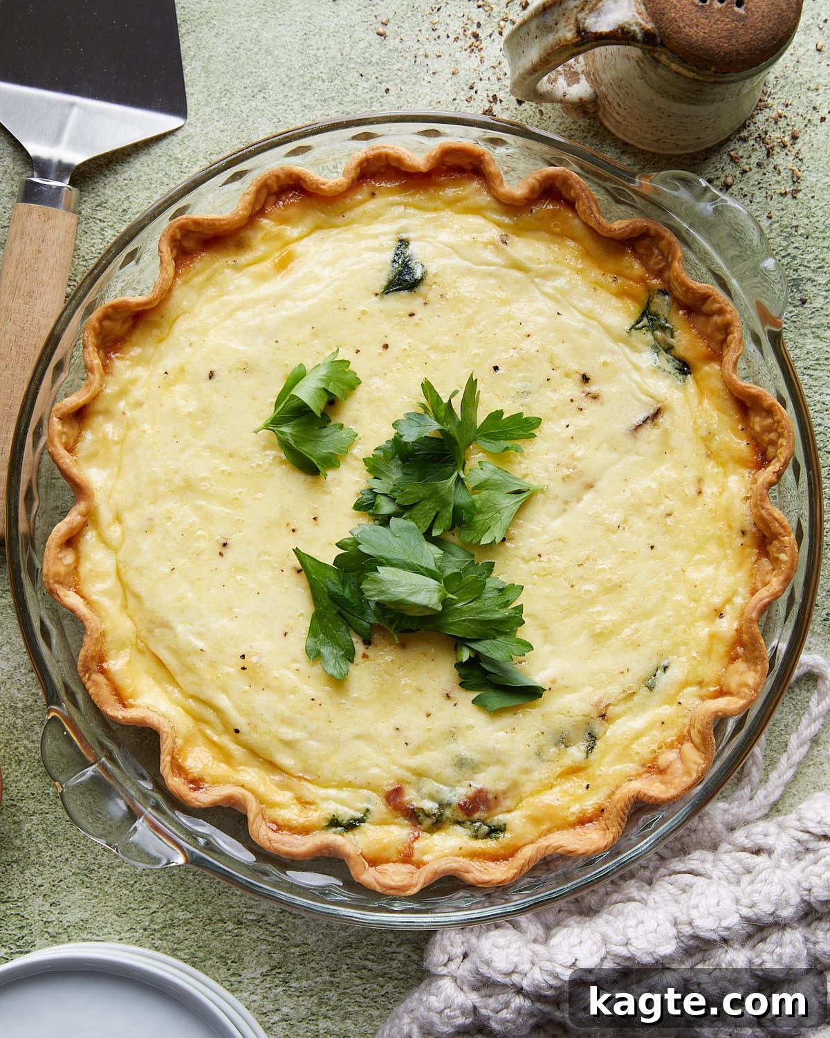 Golden Bacon, Spinach, and Mushroom Quiche with Sharp Cheddar 2 Decadent slice of Bacon Mushroom Spinach Quiche, showcasing its creamy filling and golden crust.