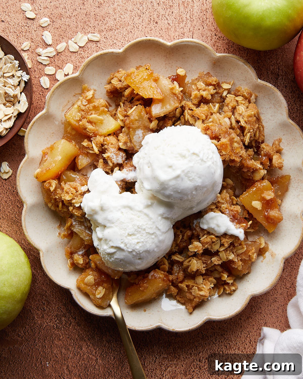 Ultimate Dutch Oven Apple Crumble 2 Overhead image of dutch oven apple crisp with ice cream topping.