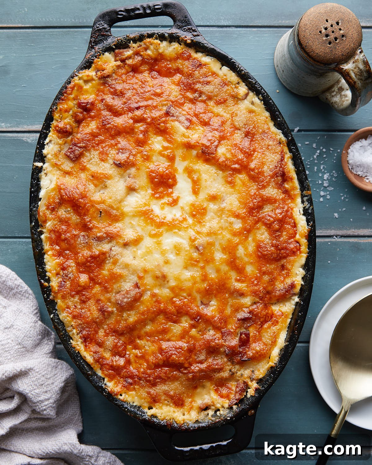 Overhead image of au gratin potatoes in black cast iron dish. 