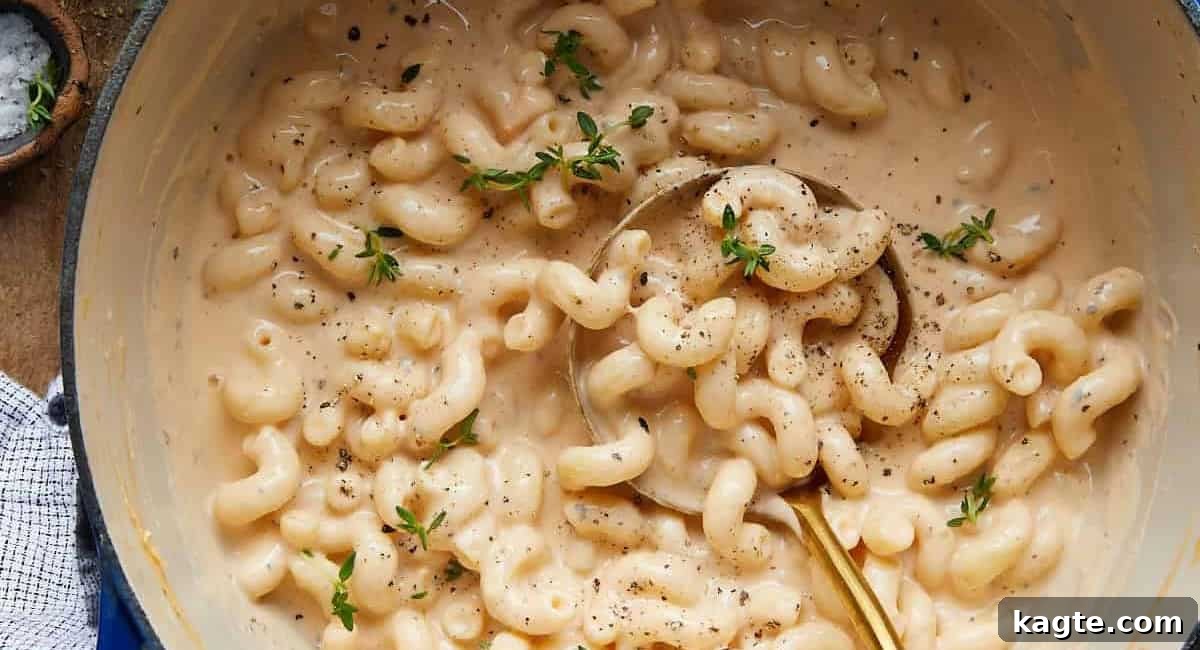 20 Perfect Sides for Chicken Cutlets 4 Overhead image of rich and creamy Dutch Oven Mac and Cheese, with a golden crust.