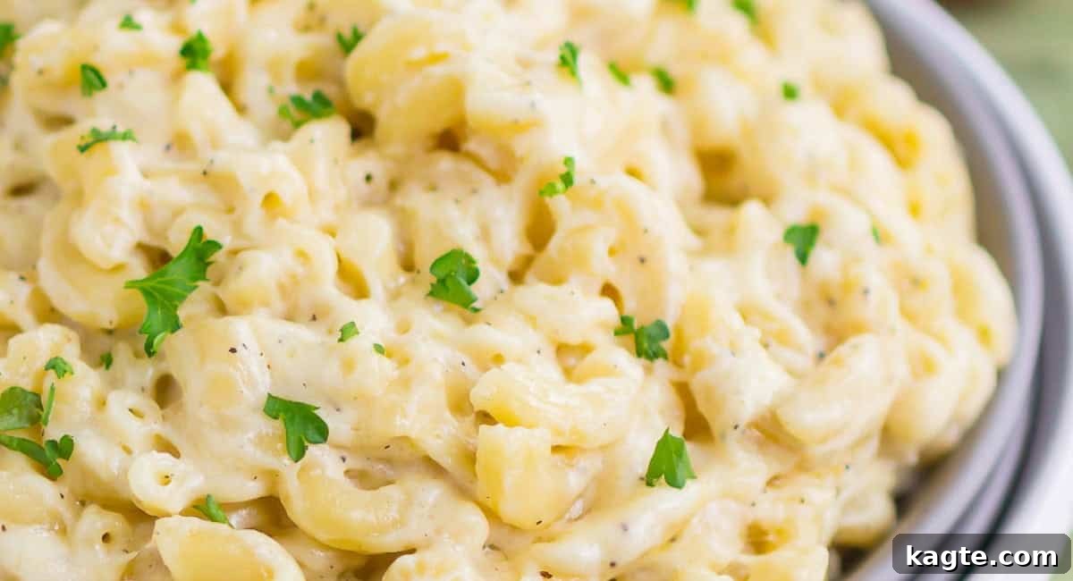 20 Perfect Sides for Chicken Cutlets 6 Overhead image of a bowl of creamy garlic Parmesan mac and cheese, ready to be served.
