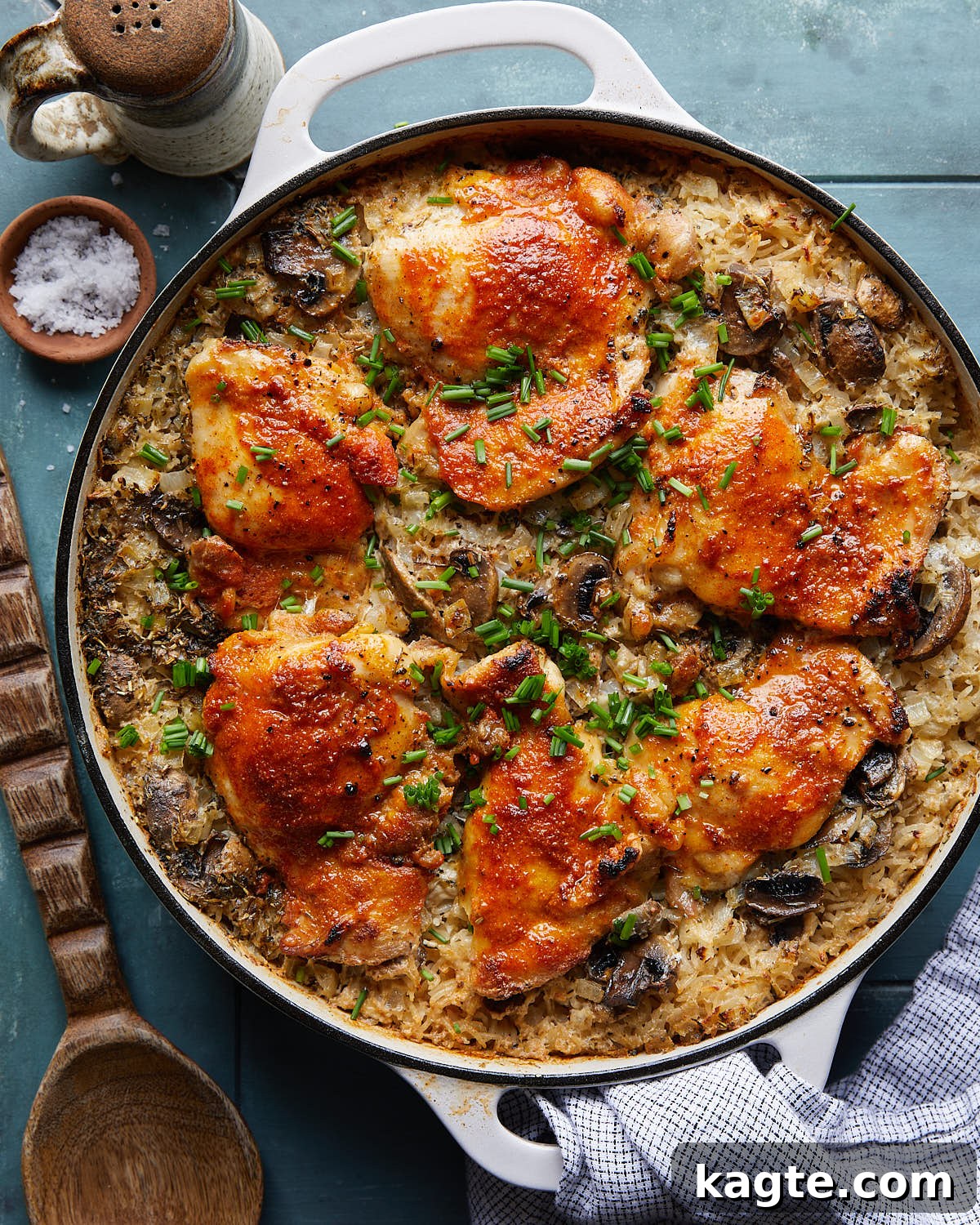 Hearty One-Pot Chicken and Rice Bake 2 Overhead image of oven baked chicken and rice in white pot.