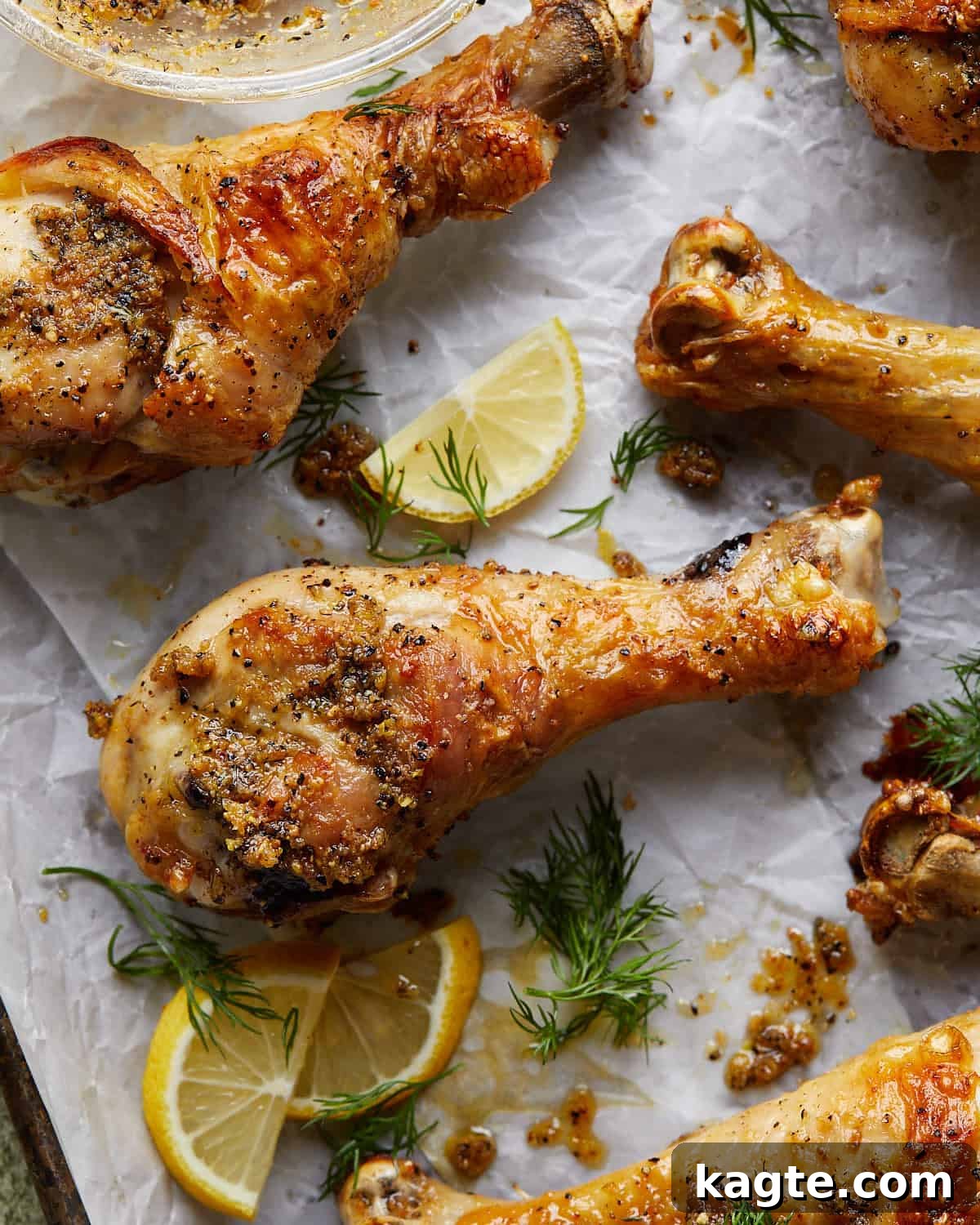 Crispy Oven Roasted Lemon Pepper Drumsticks 5 Close-up image of a single perfectly cooked crispy lemon pepper chicken drumstick, showing its golden skin and juicy texture.