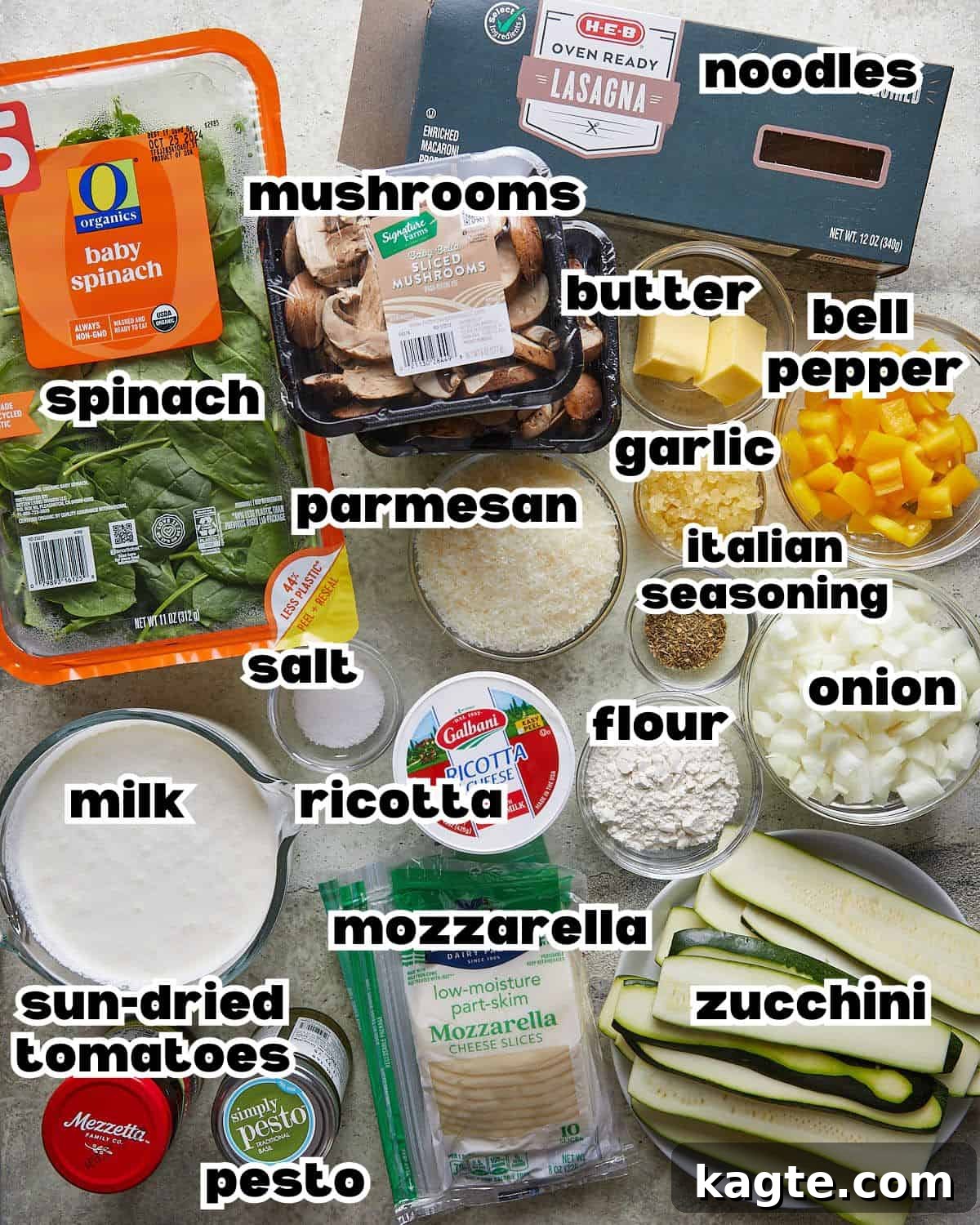 Overhead image of ingredients neatly arranged on a counter, ready to be used for making veggie lasagna with white sauce.