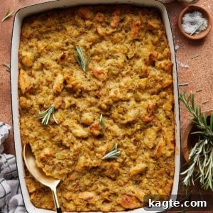 Golden-brown Make Ahead Stuffing with fresh rosemary garnish.