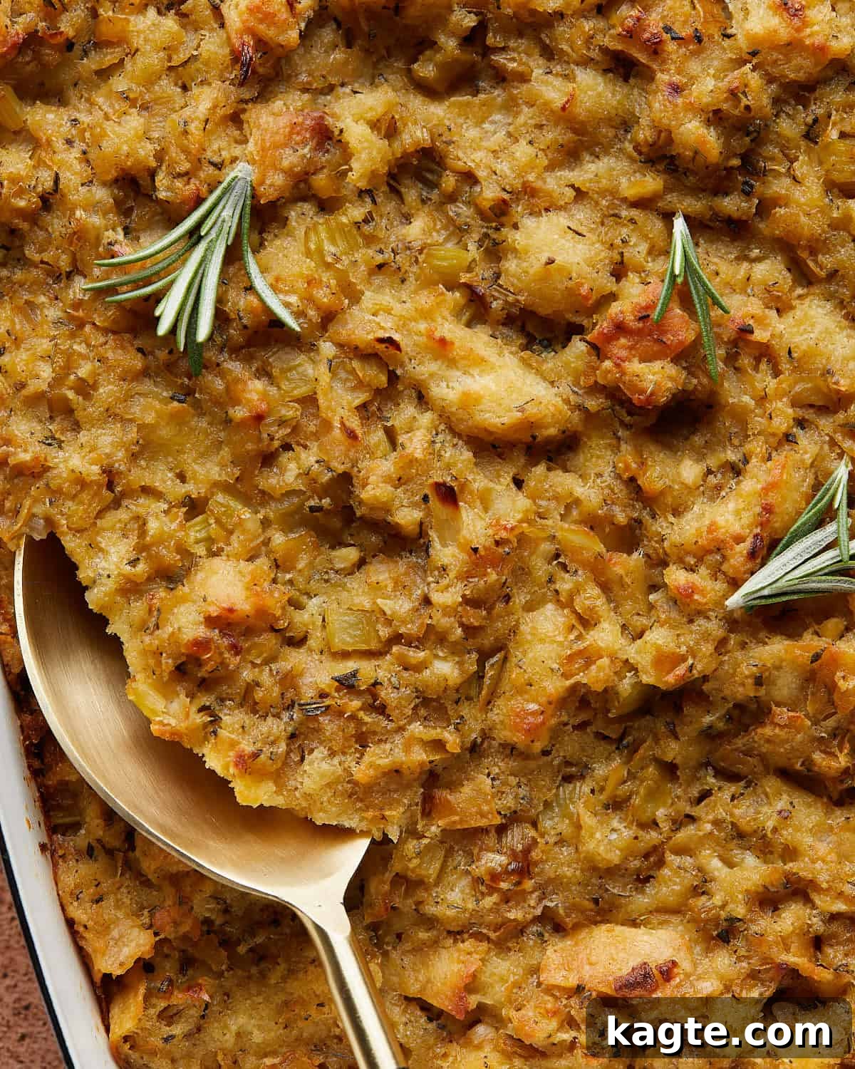 Make-Ahead Thanksgiving Stuffing 5 Up close overhead image of make ahead stuffing with garnish, highlighting its golden crust and moist interior.
