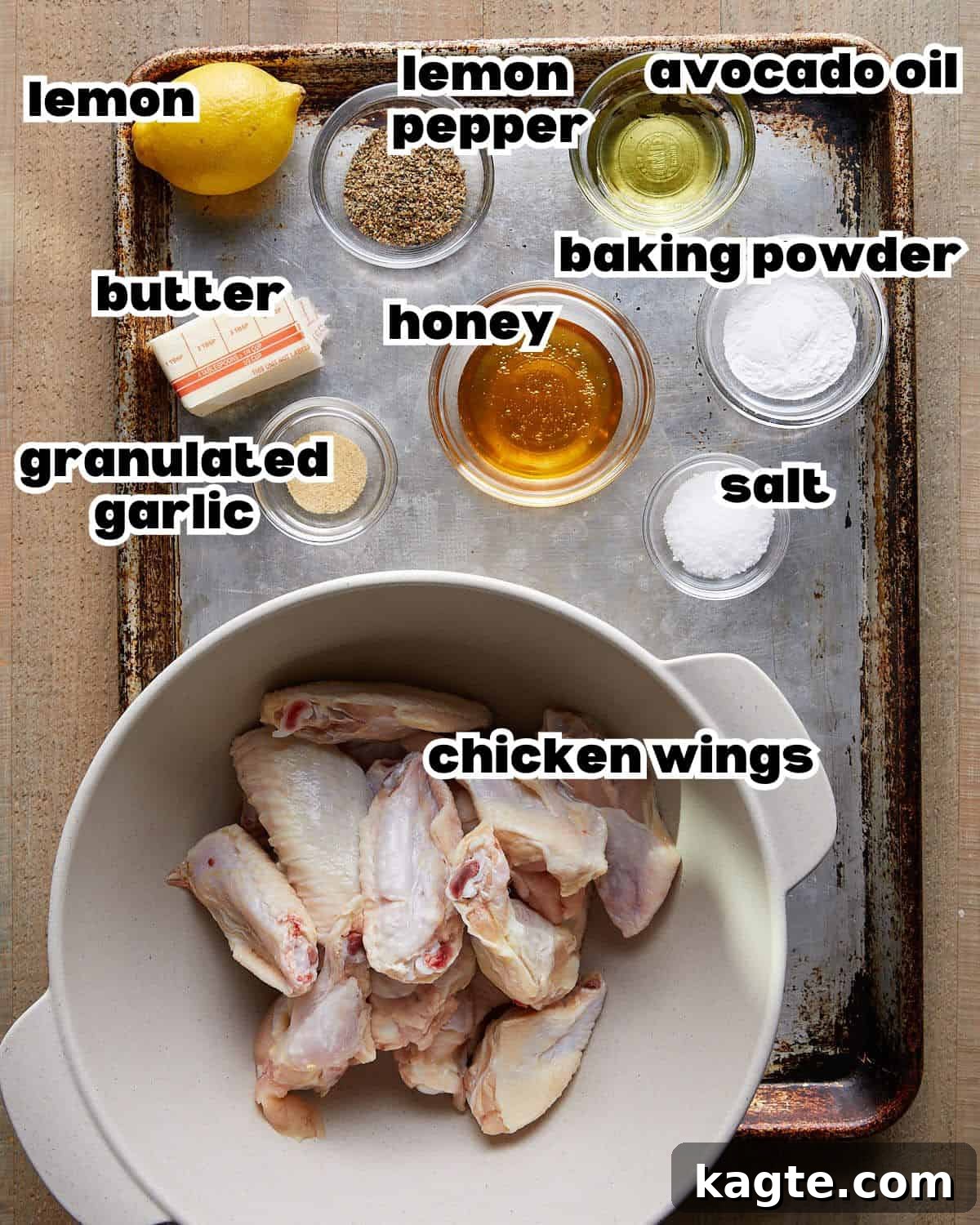 Honey Glazed Lemon Pepper Wings 3 Overhead image of all essential ingredients meticulously laid out on a clean surface, including fresh chicken wings, lemons, butter, honey, and various spices, ready for making honey lemon pepper wings.