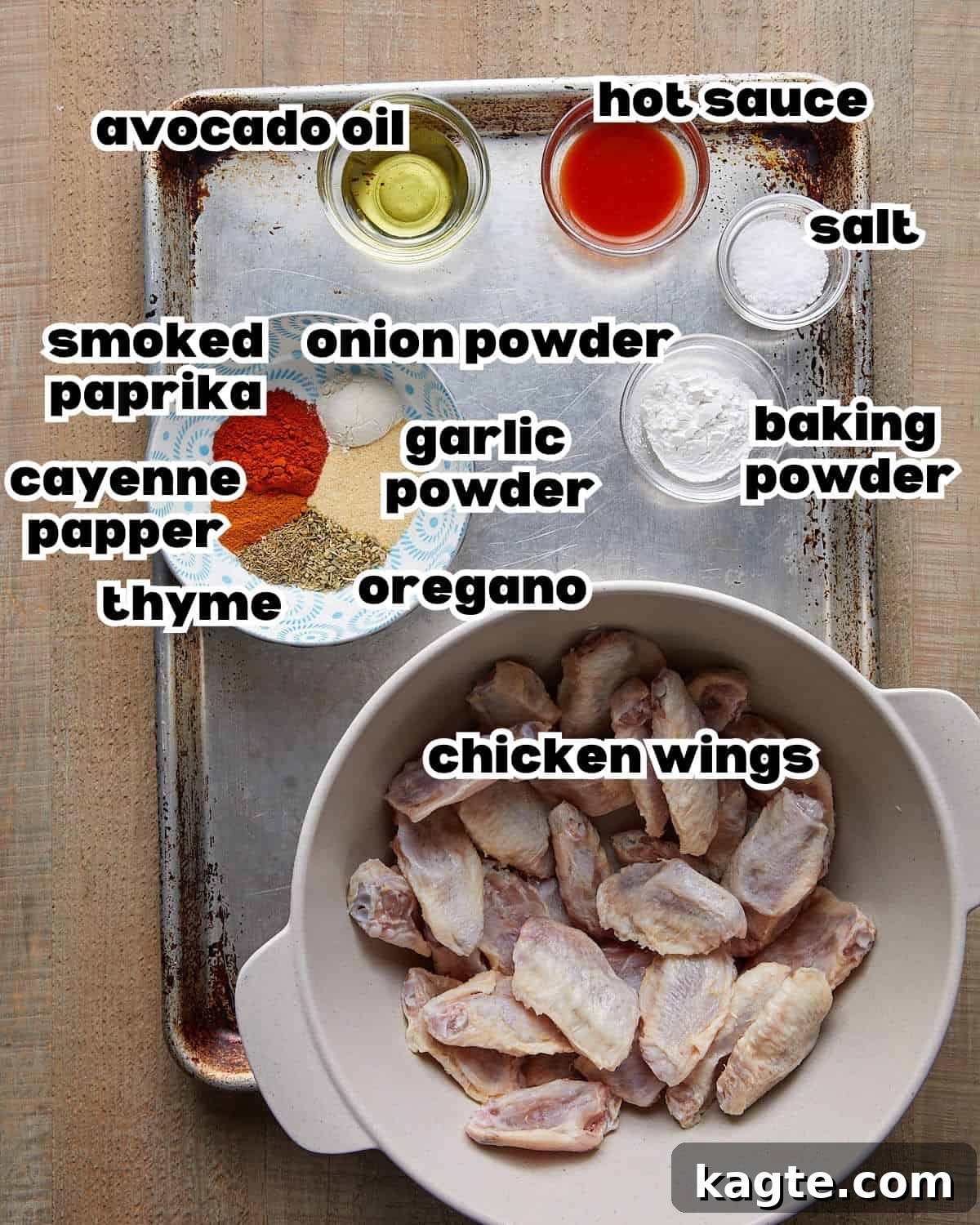 Ultimate Crispy Blackened Wings 3 Overhead image of all ingredients meticulously laid out for the blackened wings recipe, including chicken wings, various spices, and hot sauce.